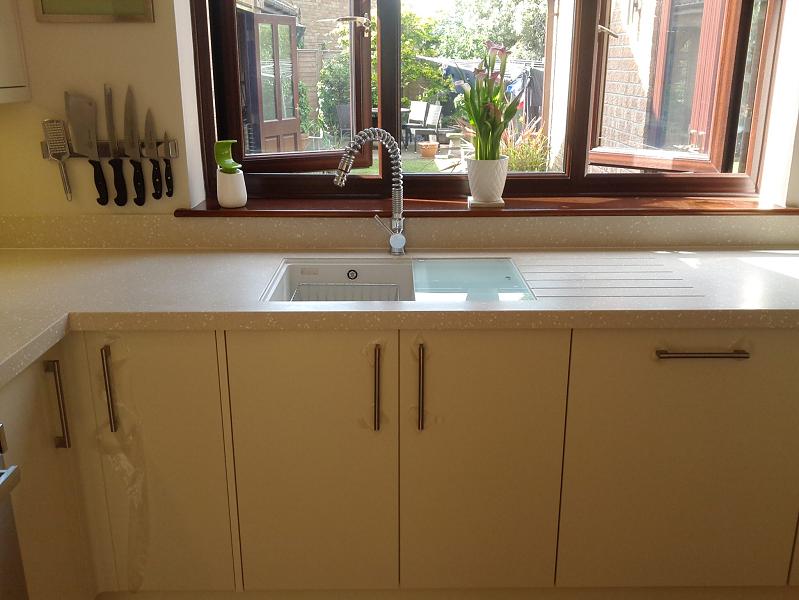 Logica Gloss Ivory kitchen fitted with Encore worktops