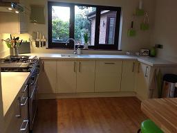 Logica Gloss Ivory Kitchen fitted with Encore Calico worktops