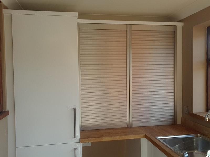 Logica White Gloss kitchen fitted with oak worktops