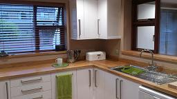 Logica White Gloss kitchen with oak worktops