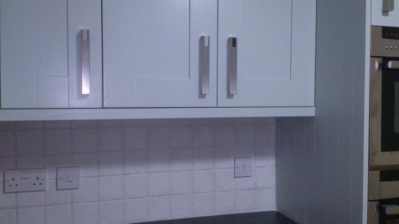 Shaker Wood Blue kitchen fitted with laminate worktops