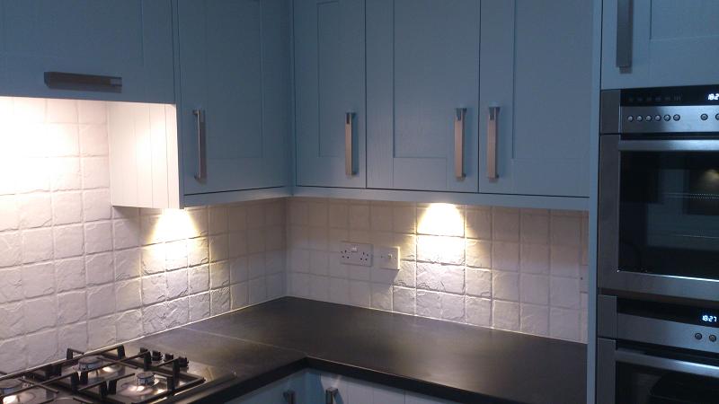 Shaker Wood Blue kitchen fitted with laminate worktops