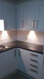 Shaker Wood Blue Kitchen with laminate worktops