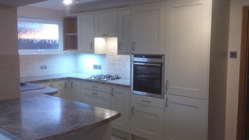 Shaker Wood Blue kitchen fitted with laminate worktops