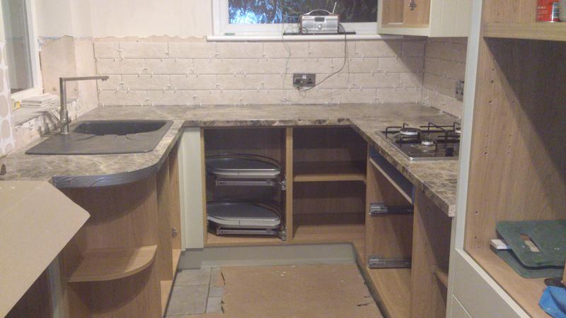 Shaker Wood Blue kitchen fitted with laminate worktops