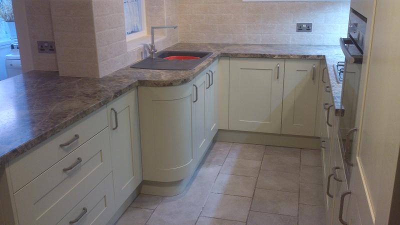 Shaker Wood Blue kitchen fitted with laminate worktops