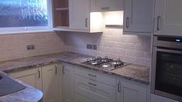 Shaker Wood Blue Kitchen with laminate worktops