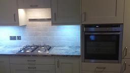 Shaker Wood Blue Kitchen with laminate worktops