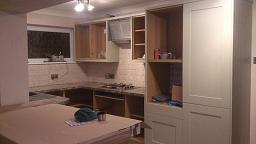 Shaker Wood Blue Kitchen with laminate worktops