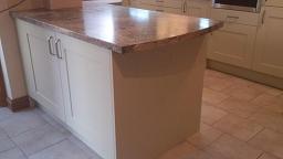 Shaker Wood Blue Kitchen with laminate worktops