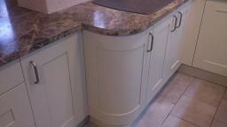 Shaker Wood Blue Kitchen with laminate worktops