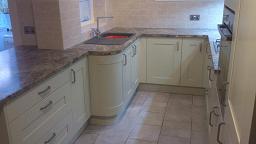 Shaker Wood Blue Kitchen with laminate worktops